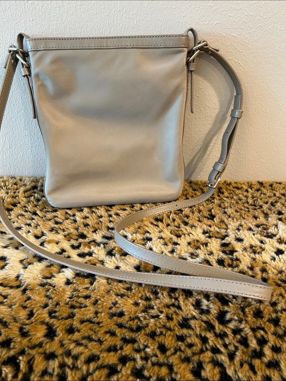 kate spade khaki-green crossbody bag with gold plaque